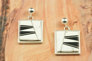Genuine Magnesite and Black Jade inlaid in Sterling Silver Post Earrings. This Beautiful Stone is formed from the mineral Magnesite. It is mined near Elko Nevada. Designed by Navajo Artist Calvin Begay. Signed.
